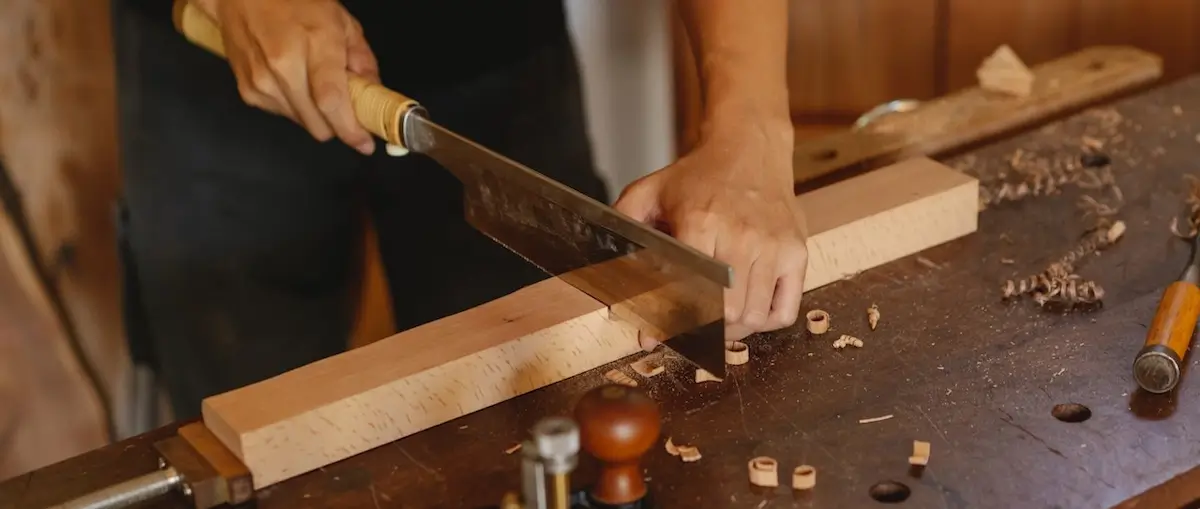 wood cutting techniques for beginners showing proper saw usage in woodworking